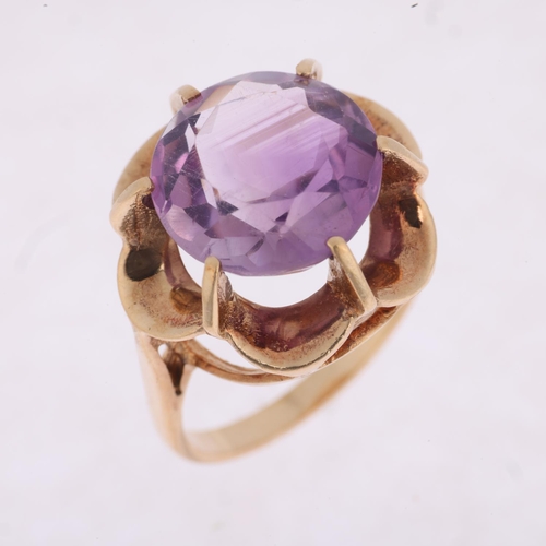 1504 - A late 20th century 9ct gold amethyst dress ring, setting height 17mm, size N, 4.9g