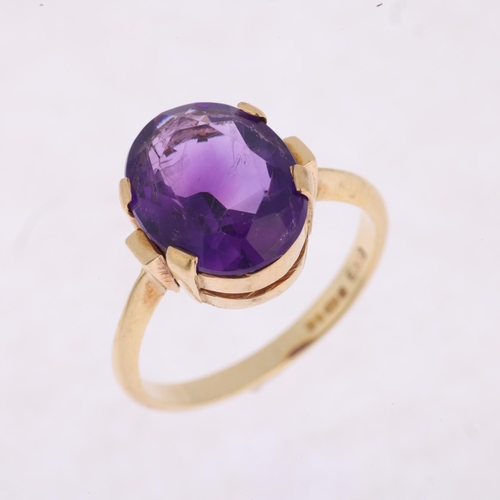 1508 - A late 20th century 9ct gold amethyst dress ring, maker LCF, London 1981, claw set with oval mixed-c... 