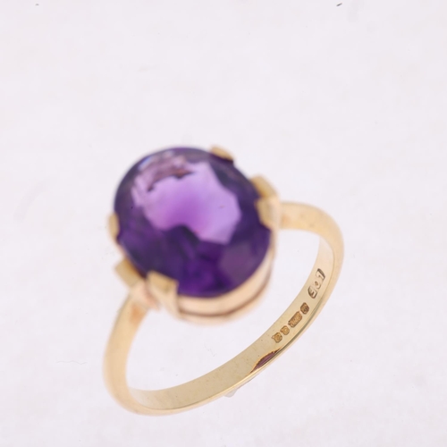 1508 - A late 20th century 9ct gold amethyst dress ring, maker LCF, London 1981, claw set with oval mixed-c... 