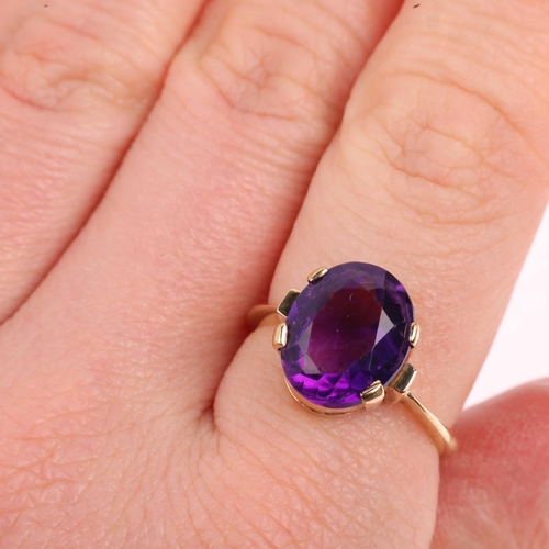 1508 - A late 20th century 9ct gold amethyst dress ring, maker LCF, London 1981, claw set with oval mixed-c... 