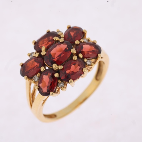 1509 - A modern 9ct gold garnet and diamond flowerhead cluster ring, setting height 13.9mm, size P, 5.5g