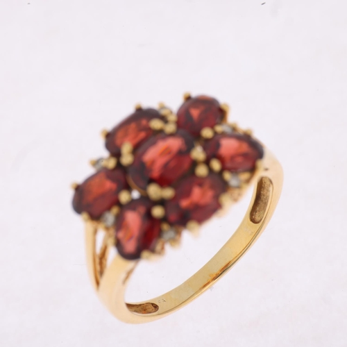 1509 - A modern 9ct gold garnet and diamond flowerhead cluster ring, setting height 13.9mm, size P, 5.5g