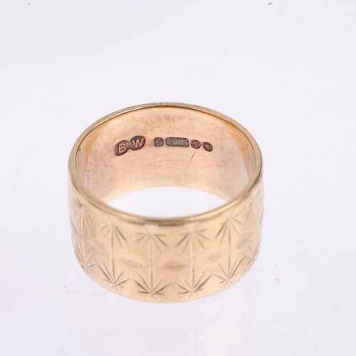 1511 - A late 20th century 9ct gold wedding band ring, maker BW, London 1973, engraved leaf decoration, ban... 