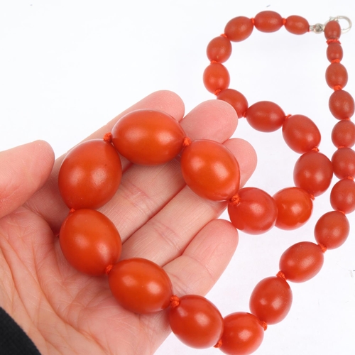 1528 - A single-strand graduated amber? bead necklace, beads measure: 24-8.6mm, 42cm, 47.5g