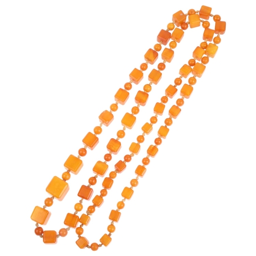 1529 - A single-strand graduated butterscotch amber cube bead necklace, beads measure: 13.9-7.2mm, 88cm, 41... 