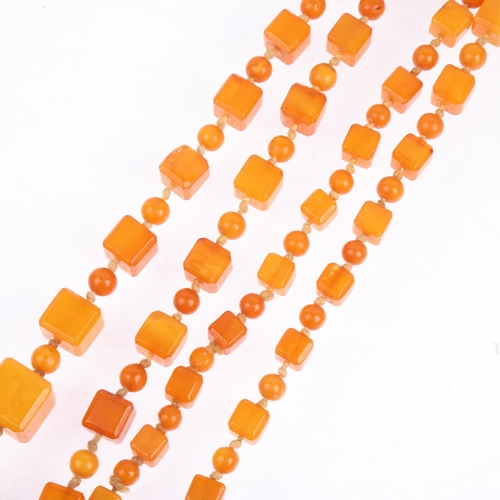 1529 - A single-strand graduated butterscotch amber cube bead necklace, beads measure: 13.9-7.2mm, 88cm, 41... 