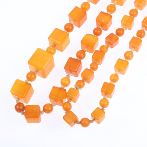 1529 - A single-strand graduated butterscotch amber cube bead necklace, beads measure: 13.9-7.2mm, 88cm, 41... 