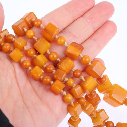 1529 - A single-strand graduated butterscotch amber cube bead necklace, beads measure: 13.9-7.2mm, 88cm, 41... 