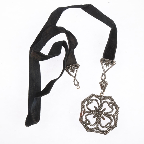 1556 - A Georgian cut-steel Tudor Rose pendant necklace, on black fabric cord, pendant 63mm, 60cm, 19.7g