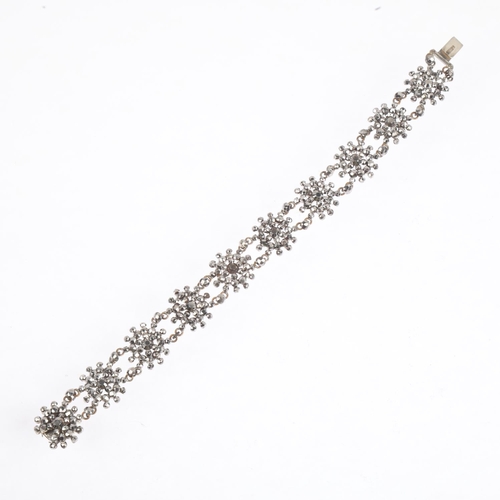 1557 - A Georgian cut-steel flowerhead panel bracelet, 18cm, 14.7g