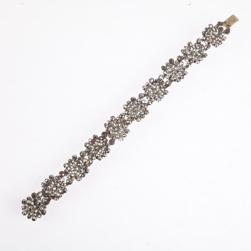 1558 - A Georgian cut-steel flowerhead panel bracelet, 18cm, 21.2g