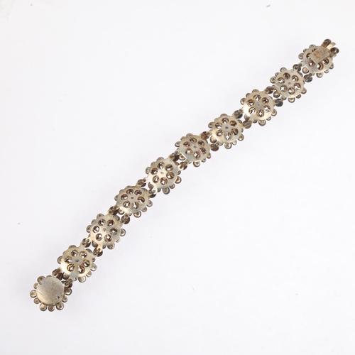 1558 - A Georgian cut-steel flowerhead panel bracelet, 18cm, 21.2g