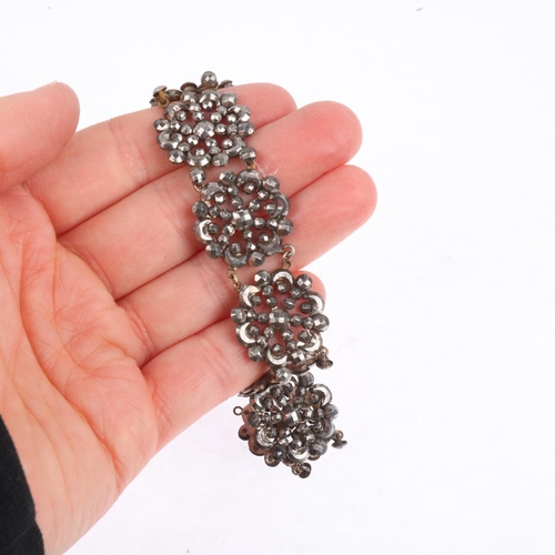 1559 - A Georgian cut-steel flowerhead panel bracelet, 18cm, 30.3g