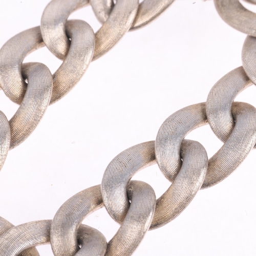 1567 - A heavy sterling silver cable link chain bracelet, textured and polished decoration, 19cm, 71.3g