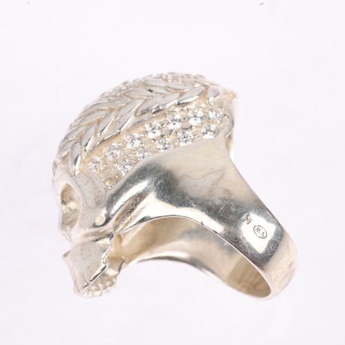 1572 - VIVIENNE WESTWOOD - a sterling silver and cubic zirconia skull ring, setting height 35.2mm, size R, ... 