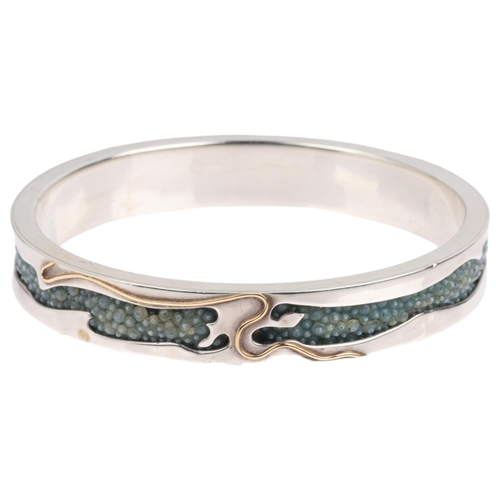 1576 - CLIVE & CLARISSA COOKE - a sterling silver 18ct gold overlaid shark skin shagreen slave bangle, make... 