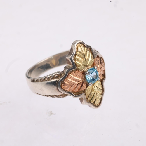 1586 - A sterling silver and 12k two-colour gold blue topaz 'Black Hills' leaf ring, setting height 19.5mm,... 