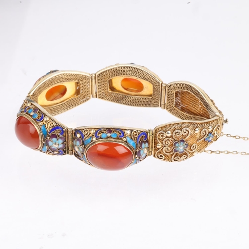 1593 - A Chinese silver-gilt carnelian and enamel panel bracelet, band width 19.5mm, internal circumference... 