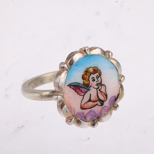 1608 - A Vintage enamel cherub ring, unmarked silver settings, setting height 17.7mm, size K, 4.7g