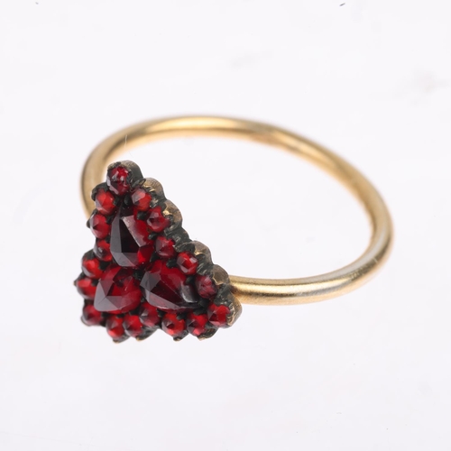 1609 - A Victorian faceted garnet cluster ring, apparently unmarked, setting height 12.4mm, size O, 2g