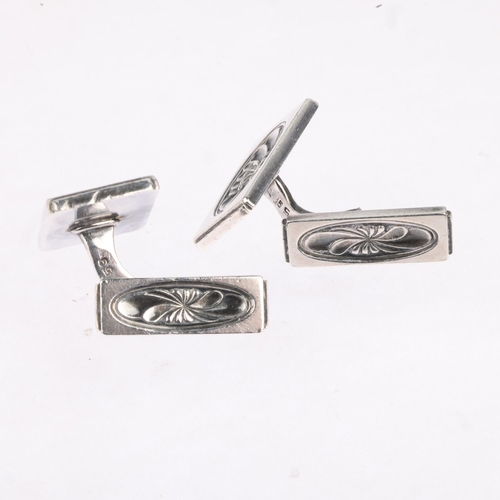 1625 - GEORG JENSEN - a pair of a Danish modernist sterling silver Lotus pattern cufflinks, designed by Hen... 