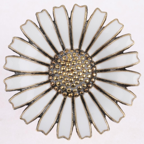 1627 - ANTON MICHELSEN - a a Danish modernist sterling silver-gilt white enamel daisy pattern brooch, 32.2m... 