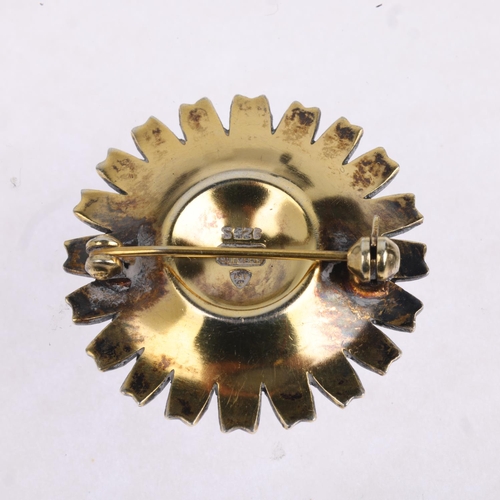 1627 - ANTON MICHELSEN - a a Danish modernist sterling silver-gilt white enamel daisy pattern brooch, 32.2m... 