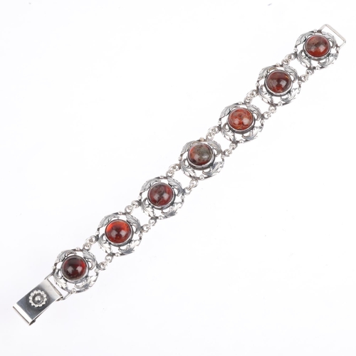 1667 - BRDR BJORKLUND - an Art Nouveau style Danish sterling silver amber floral panel bracelet, 18.5cm, 27... 