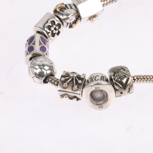 1668 - A sterling silver snake link charm bracelet, in the style of Pandora, with 9 silver charms including... 