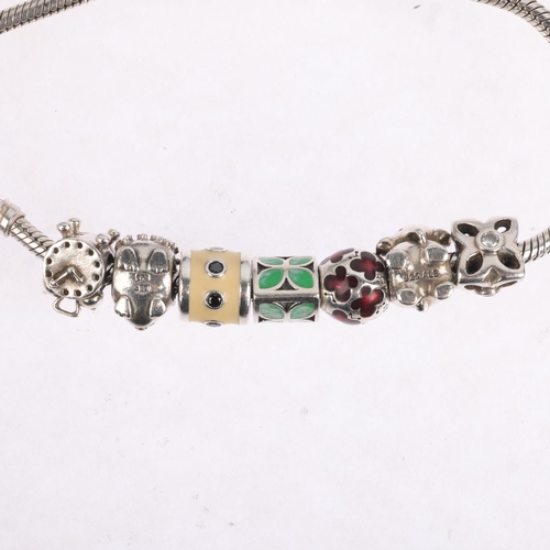 1669 - PANDORA - a sterling silver snake link charm bracelet, with 7 silver charms, 21cm, 40.8g