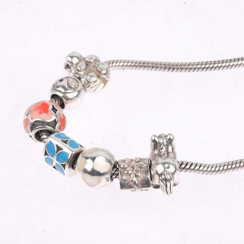 1671 - PANDORA - a sterling silver snake link charm bracelet, with 7 silver charms, 21cm, 40.7g