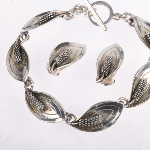 1679 - AARRE & KROGH - a a Danish modernist sterling silver floral panel bracelet and pair of clip-on earri... 