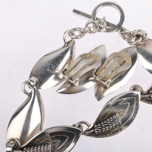 1679 - AARRE & KROGH - a a Danish modernist sterling silver floral panel bracelet and pair of clip-on earri... 