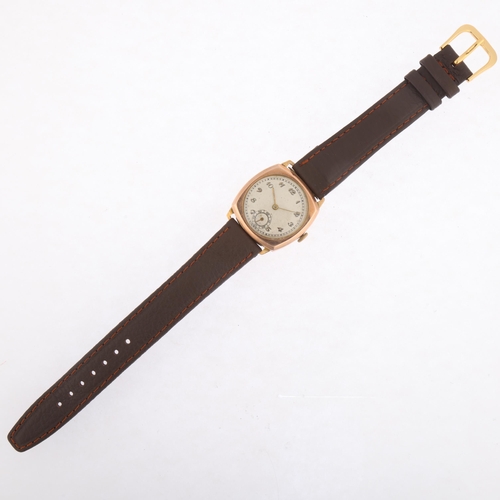 1042 - A mid-20th century 9ct rose gold cushion-cased mechanical wristwatch, silvered dial with applied gil... 