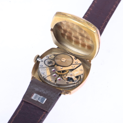 1042 - A mid-20th century 9ct rose gold cushion-cased mechanical wristwatch, silvered dial with applied gil... 