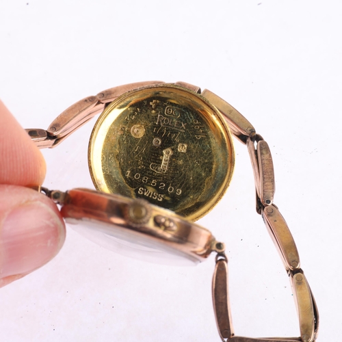 1054 - ROLEX - a First World War Period 9ct rose gold mechanical bracelet watch, silvered engine turned sun... 