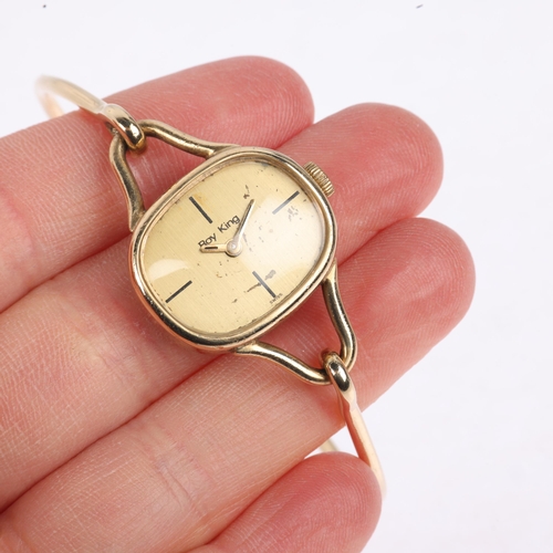 1063 - ROY KING - a lady's Vintage 9ct gold mechanical bangle watch, circa 1970s, champagne dial with quart... 