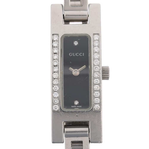 1071 - GUCCI - a lady's stainless steel diamond 3900L quartz bracelet watch, black dial with halfly diamond... 