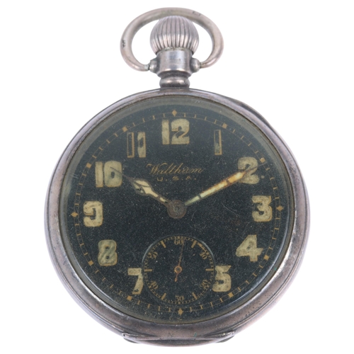 1104 - WALTHAM - a silver open-face keyless pocket watch, black enamel dial with Arabic numerals, cathedral... 