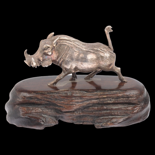 1750 - PATRICK MAVROS (Zimbabwean) - a cast-silver model warthog, realistically modelled on hardwood base, ... 