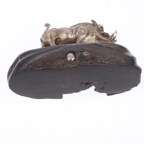 1750 - PATRICK MAVROS (Zimbabwean) - a cast-silver model warthog, realistically modelled on hardwood base, ... 