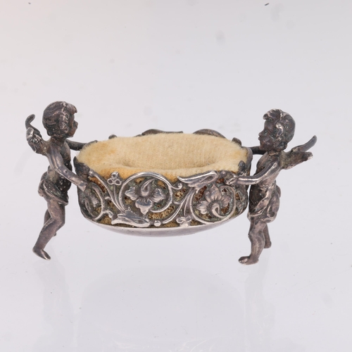 1771 - A German silver cherub dressing table ring holder/pin cushion, Neresheimer, Hanau, circa 1900, impor... 