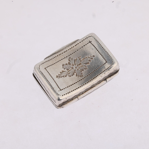 1783 - A George IV silver vinaigrette, maker TS, Birmingham 1822, curved rectangular form, with bright-cut ... 