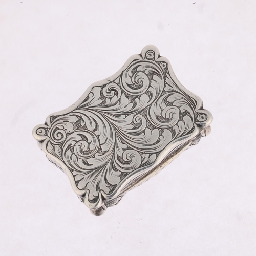 1788 - A Victorian silver vinaigrette, Edward Smith, Birmingham 1849, shaped rectangular form, with allover... 