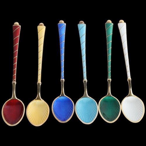 1910 - EGON LAURIDSEN - a set of 6 Danish vermeil sterling silver and harlequin enamel coffee spoons, with ... 