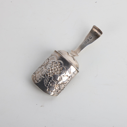 1924 - A George III silver shovel tea caddy spoon, William Lea & Co, Birmingham 1816, relief embossed and g... 