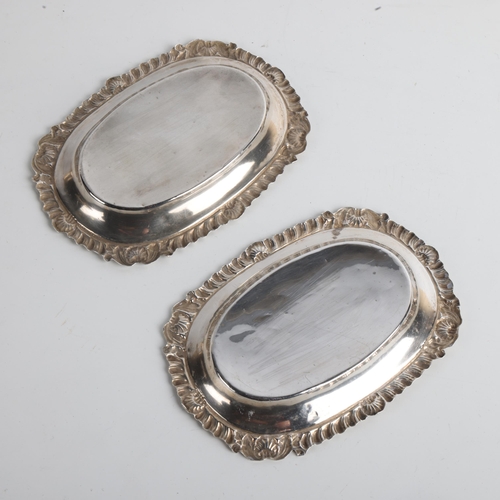 1932 - A pair of Edwardian silver pin dishes, George Nathan & Ridley Hayes, Chester 1902 and 1904, 11cm x 7... 