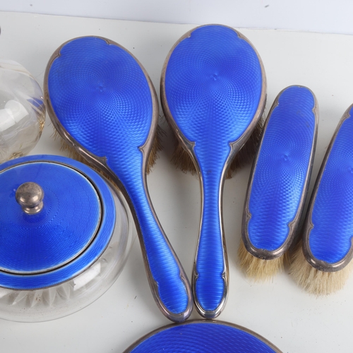 1947 - An Art Deco George V silver and blue enamel 9-piece dressing table vanity set, Walker & Hall, Birmin... 