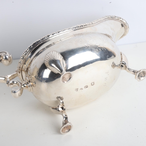 1951 - A fine pair of George II silver sauce boats, Robert Innes, London 1751, gadrooned rims with scrolled... 