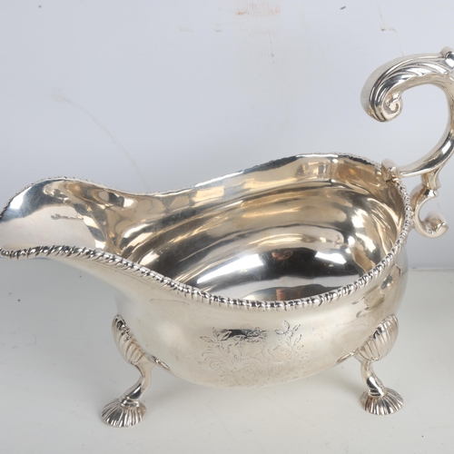 1951 - A fine pair of George II silver sauce boats, Robert Innes, London 1751, gadrooned rims with scrolled... 